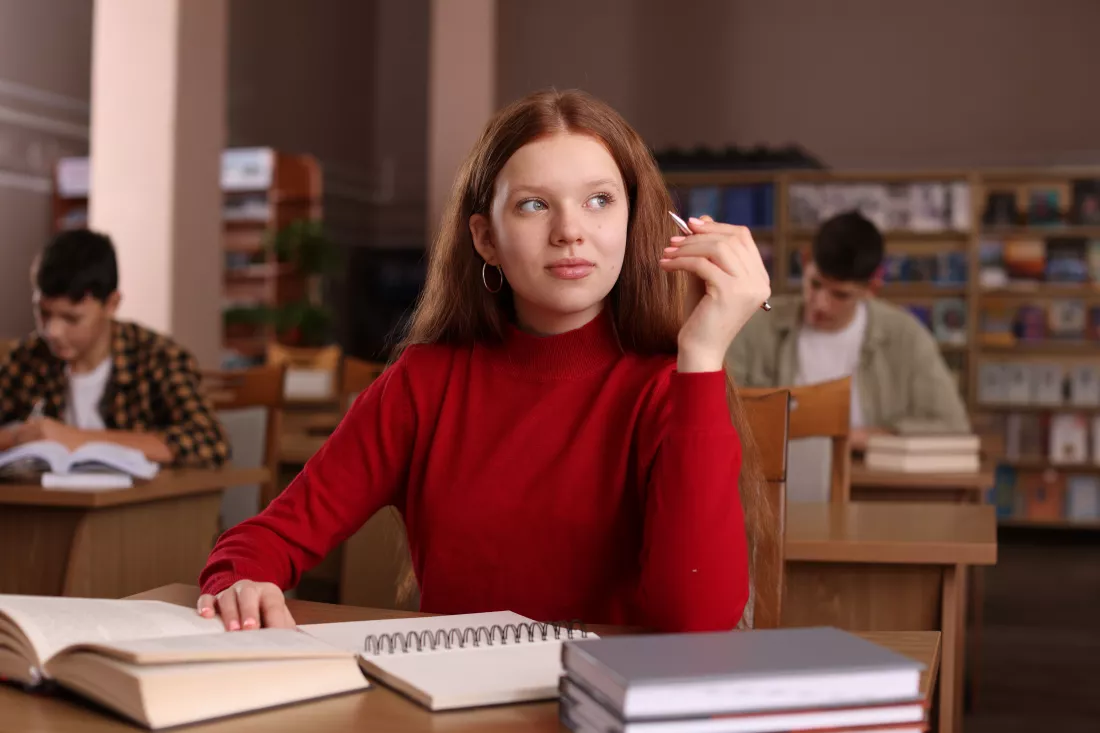 girl-studying-desk-public-library