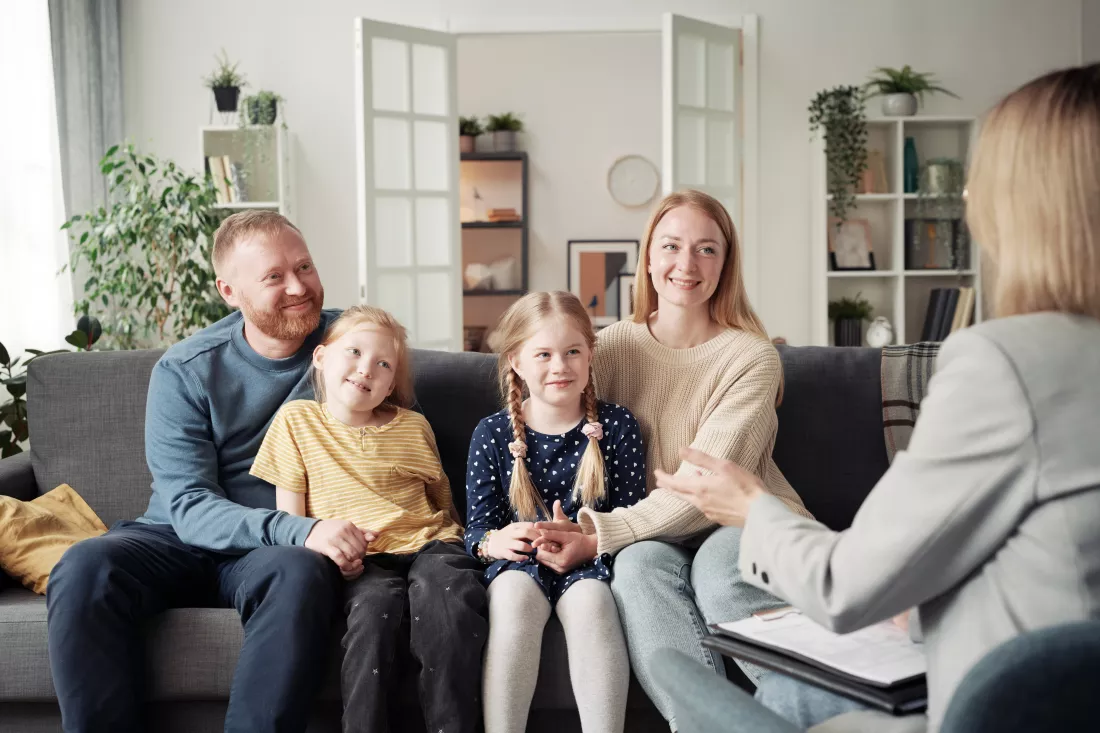 social-worker-talking-adoptive-family-home