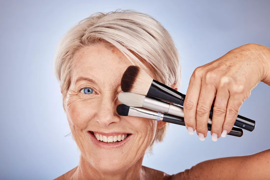 woman-face-makeup-with-cosmetics-brush-beauty-skincare-wellness-product-studio-spa-luxury-skin-healthcare-senior-model-facial-self-care-dermatology-against-grey-background