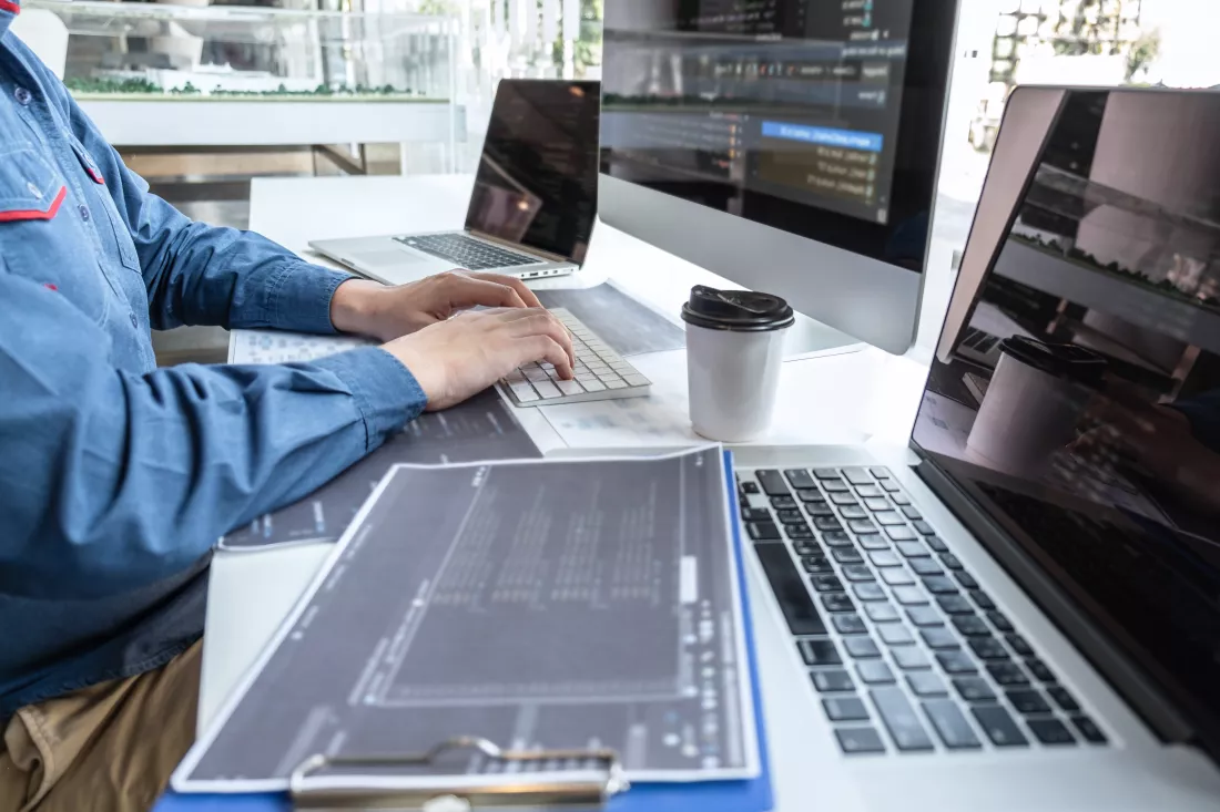 low-angle-view-man-using-laptop-table