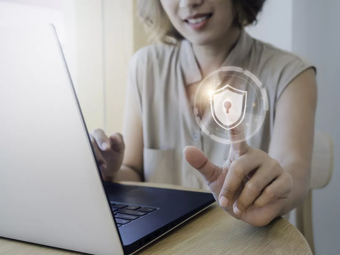 cyber-security-personal-data-protection-business-privacy-concept-shield-lock-icon-air-while-woman-scanned-by-her-finger-access-identification-while-using-laptop-computer