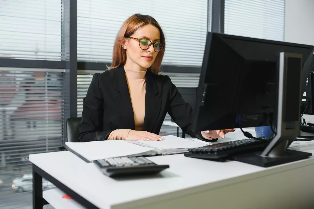 confident-businesswoman-stands-office
